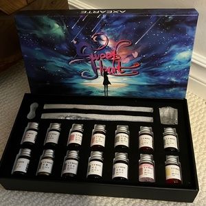 Glass wands with coloured ink for calligraphy